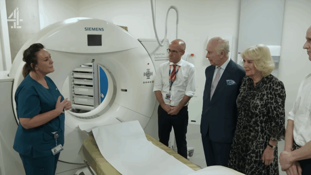 King Charles and Camilla in a hospital.