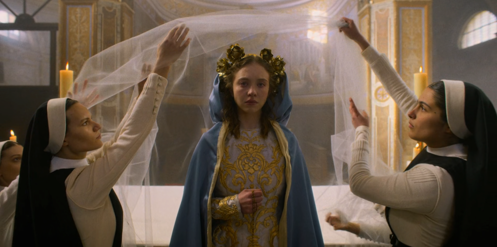 A tearful Sydney Sweeney, dressed as a Catholic religious icon, in the film 'Immaculate.'