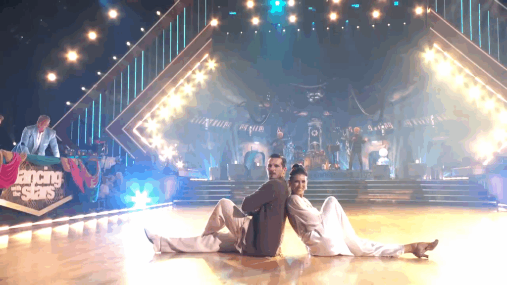 Hilaria Baldwin sitting on the DWTS stage.