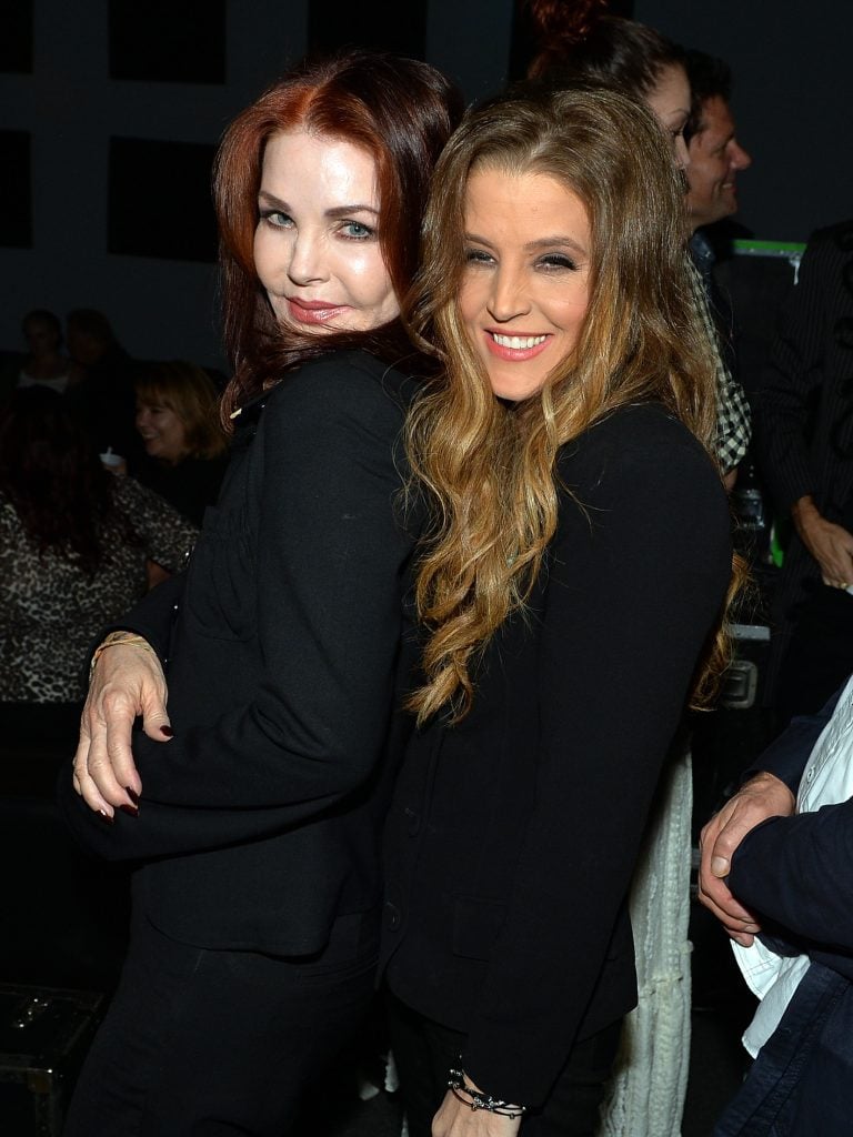Priscilla Presley celebrates backstage with her daughter Lisa Marie Presley after Lisa Marie's performance at 3rd & Lindsley during the 14th Annual Americana Music Festival & Conference on September 20, 2013 in Nashville, United States. 