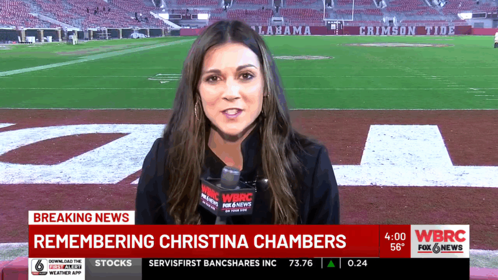 Christina Chambers beside a sports field.