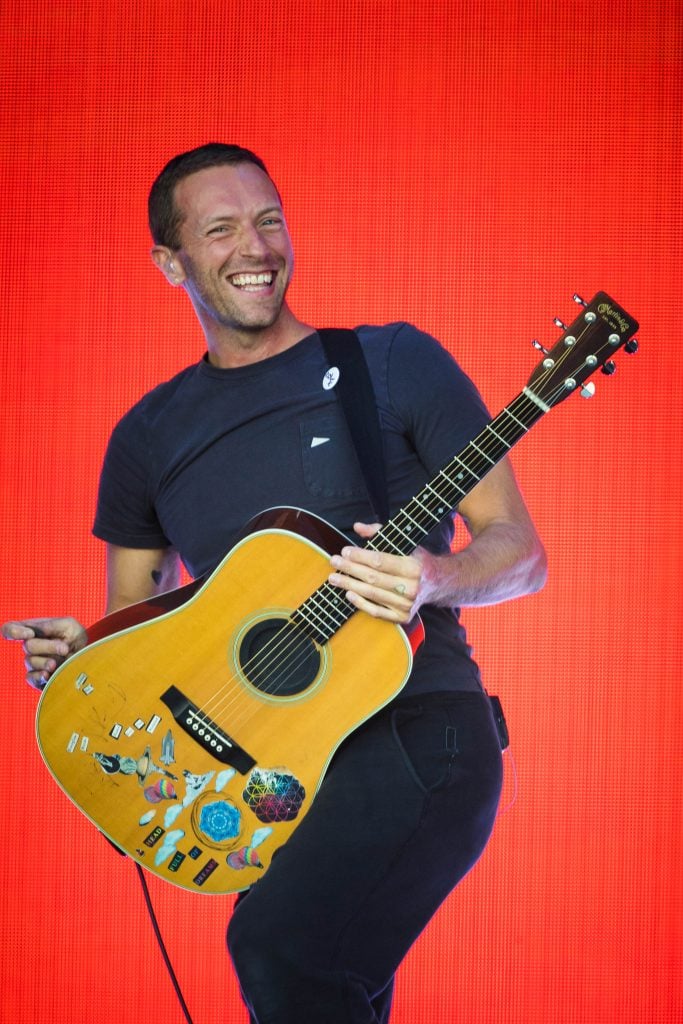 Chris Martin of Coldplay performs on the Pyramid stage on day five of Glastonbury Festival at Worthy Farm, Pilton on June 30, 2019 in Glastonbury, England. 
