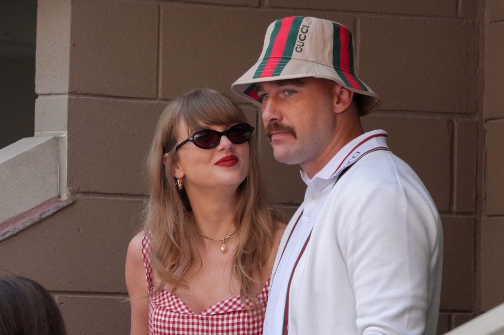 US musician Taylor Swift (L) and US NFL football player Travis Kelce (R) attend the men's final match between Italy's Jannik Sinner and USA's Taylor Fritz on day fourteen of the US Open tennis tournament at the USTA Billie Jean King National Tennis Center in New York City, on September 8, 2024.