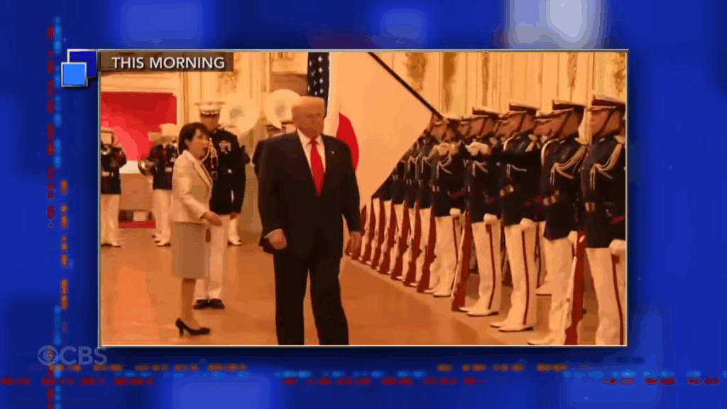 A screenshot from The Late Show showing Donald Trump wandering away from Japan's newly elected Prime Minister.
