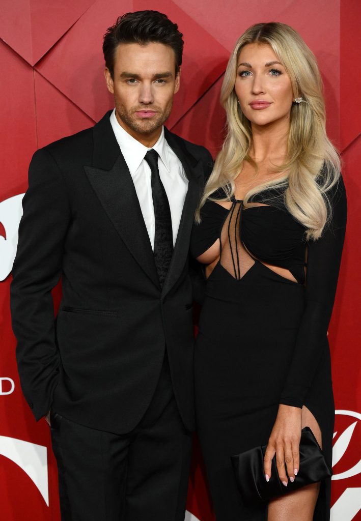 English singer Liam Payne and US actor Katie Cassidy  pose on the red carpet upon arrival at The 2022 Fashion Awards in London on December 5, 2022. 