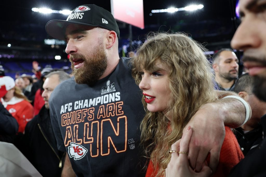 Travis Kelce #87 of the Kansas City Chiefs celebrates with Taylor Swift after a 17-10 victory against the Baltimore Ravens in the AFC Championship Game at M&T Bank Stadium on January 28, 2024 in Baltimore, Maryland.