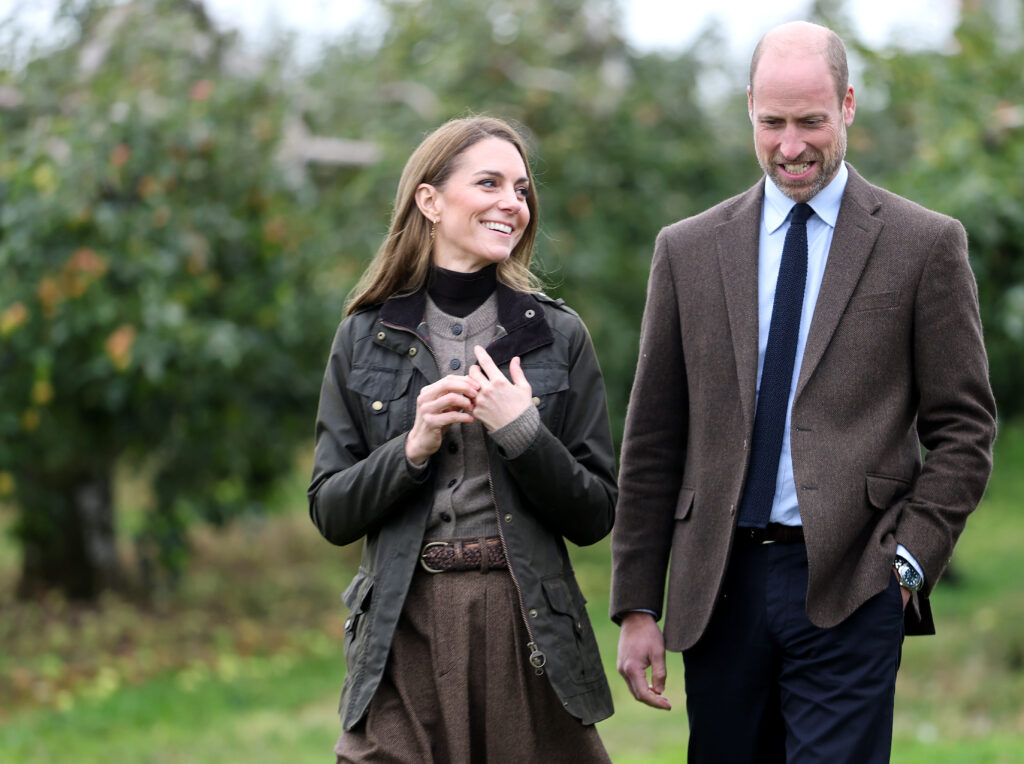 Catherine, Princess of Wales and Prince William, Prince of Wales walk in the orchards as they visit to Long Meadow Cider on October 14, 2025 in Craigavon, Northern Ireland.