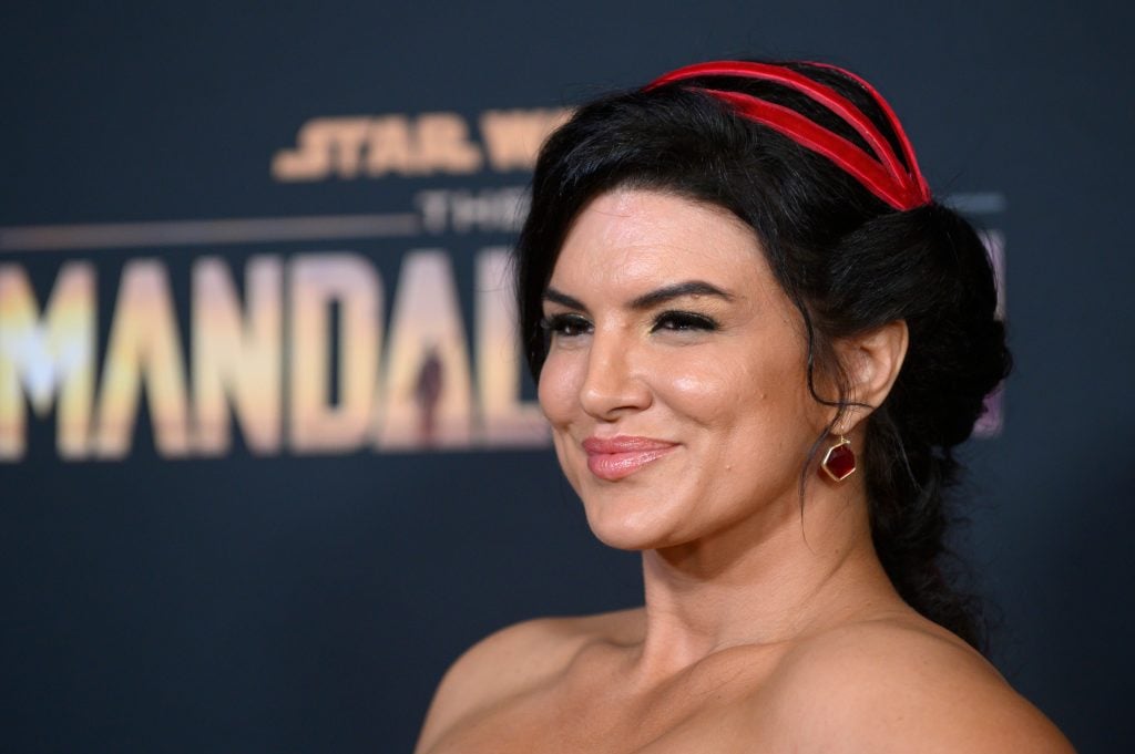 Gina Carano smiles in 2019, before she'd shown people who she is.