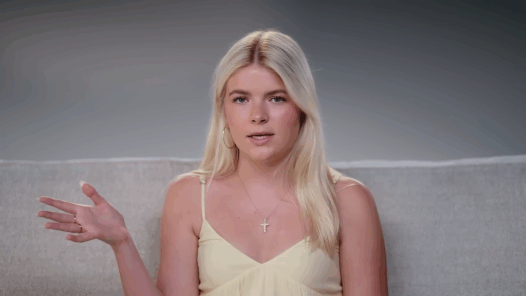 Lola Sheen addresses the camera.