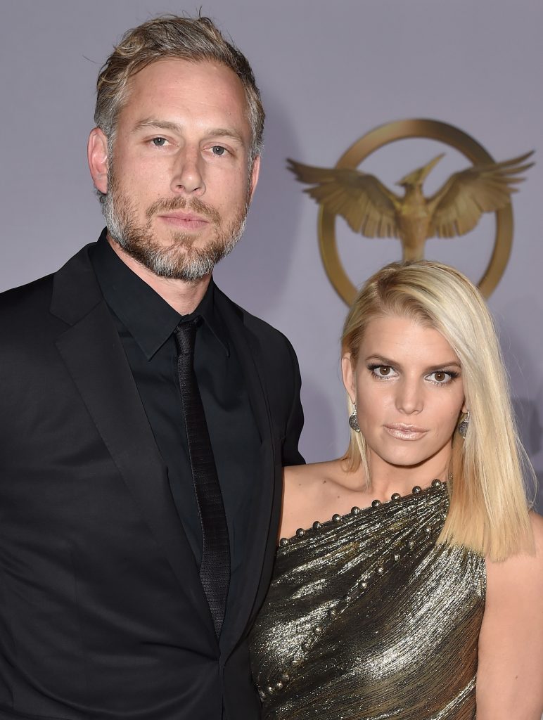 Eric Johnson (L) and singer/songwriter Jessica Simpson attend the premiere of Lionsgate's The Hunger Games: Mockingjay - Part 1 at Nokia Theatre L.A. Live on November 17, 2014 in Los Angeles, California.  