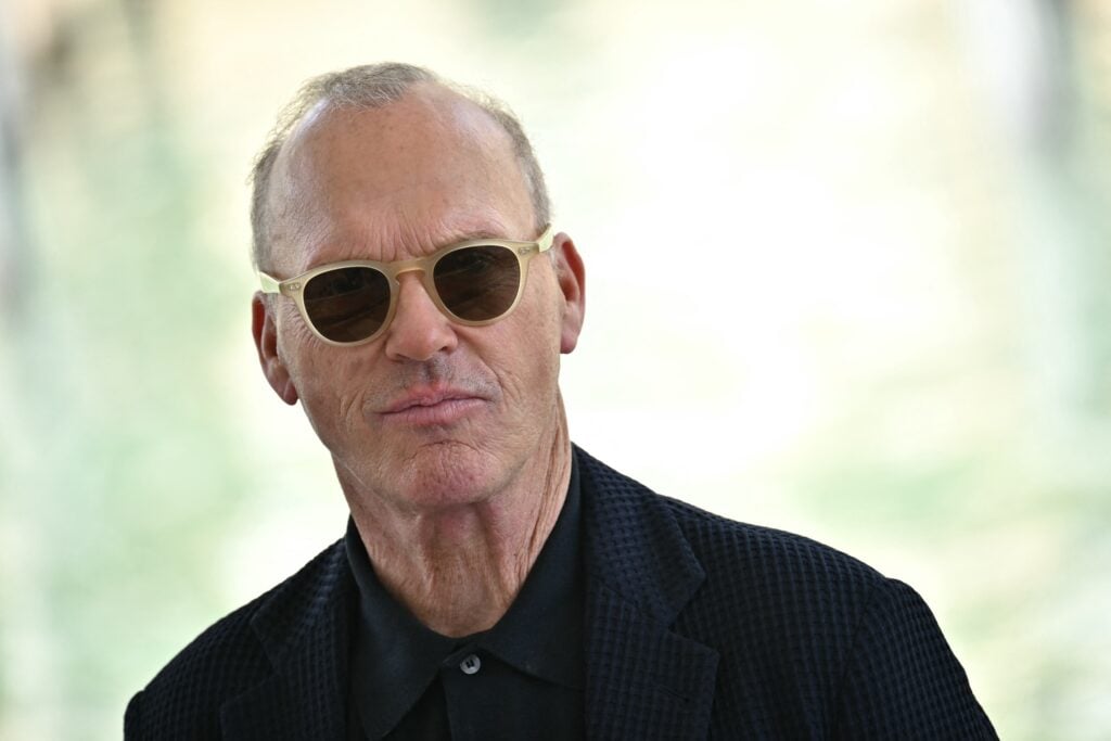 Michael Keaton wears shades.