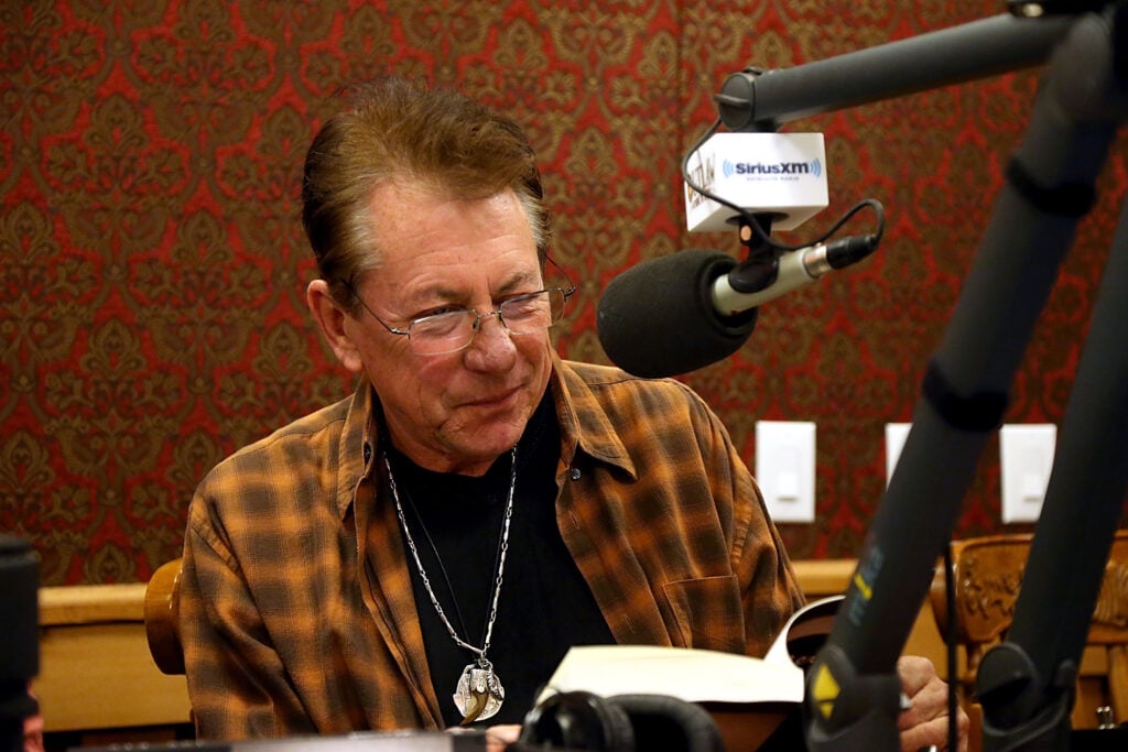 Joe Ely reads from his new book Reverb while visiting Mojo Nixon in Celebration of his 10 Year Anniversary On SiriusXM with A special live show at the SiriusXM Studios on November 12, 2014 in Austin, Texas. 