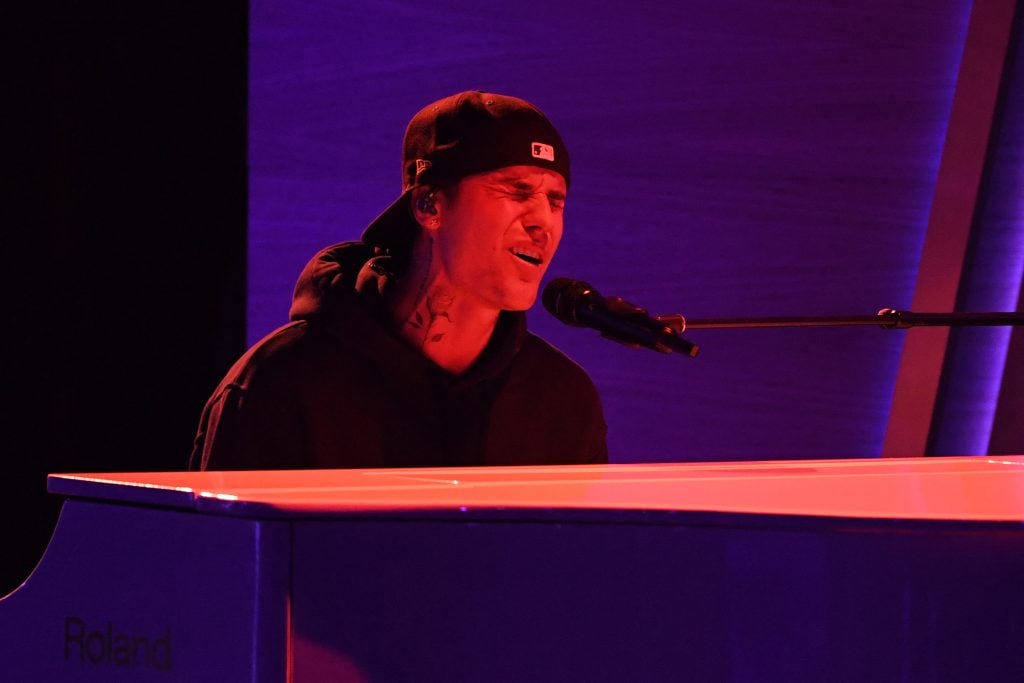 Justin Bieber plays piano and sings in April 2022.