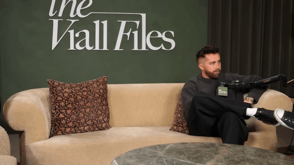 Jordan Ngatikaura alone on the sofa.