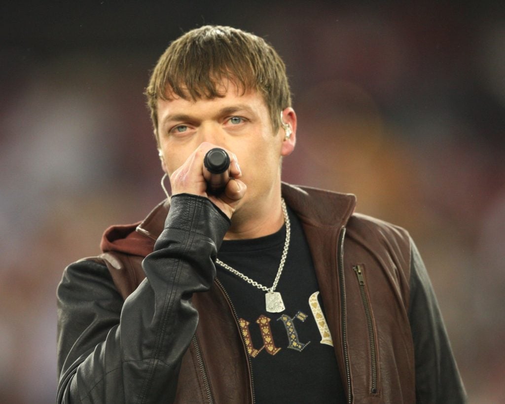 Brad Arnold of the band 3 Doors Down performs at halftime during the 2010 NFC wild-card playoff game between the Green Bay Packers and the Arizona Cardinals at University of Phoenix Stadium on January 10, 2010 in Glendale, Arizona. 