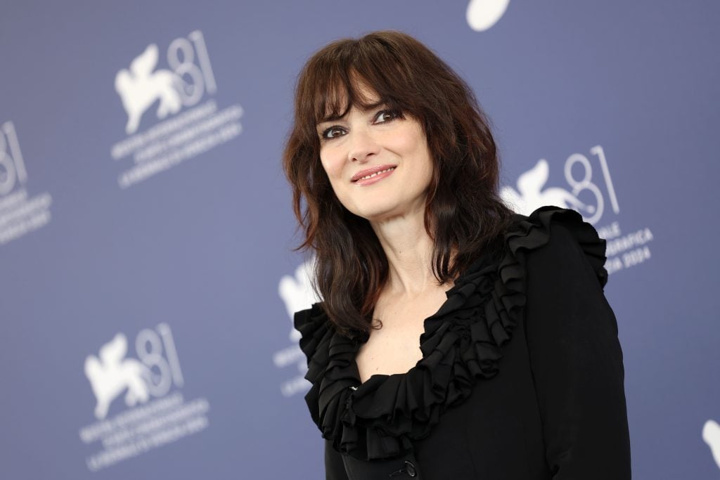 Winona Ryder attends a photocall for Beetlejuice Beetlejuice during the 81st Venice International Film Festival at  on August 28, 2024 in Venice, Italy. 