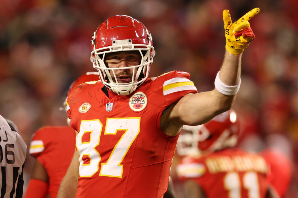 Travis Kelce signals for a first down while on the field for the Kansas City Chiefs.