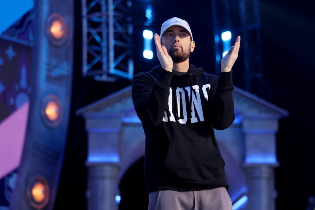 Rapper Marshall Eminem Mathers claps during the first round of the 2024 NFL Draft at Campus Martius Park and Hart Plaza on April 25, 2024 in Detroit, Michigan.