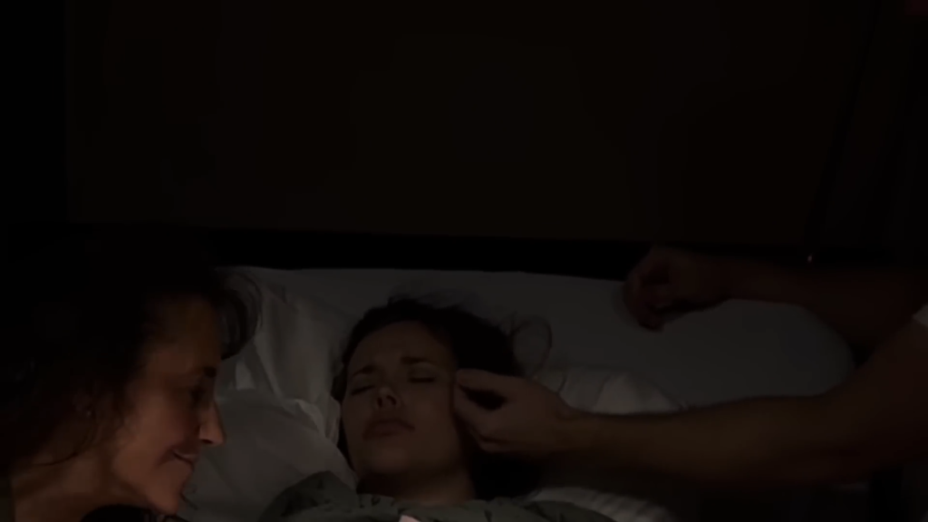 Jessa Duggar in the delivery bed with Michelle Duggar by her side.