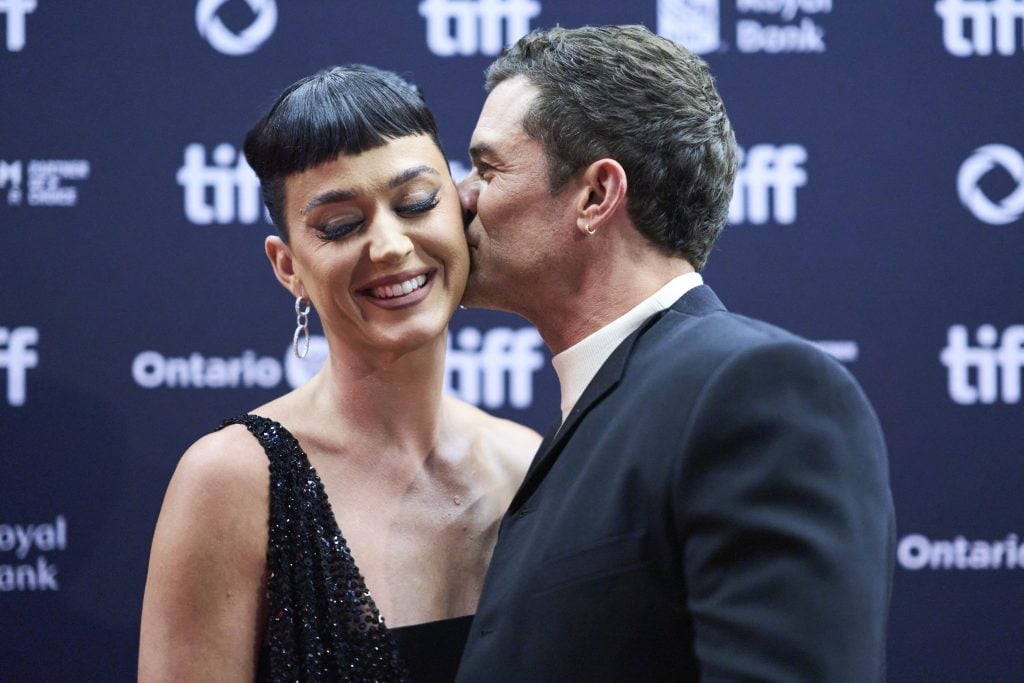 English actor Orlando Bloom and his partner US singer Katy Perry arrive for the premiere of The Cut during the Toronto International Film Festival at the Princess of Wales Theatre in Toronto, Ontario, Canada, on September 5, 2024.