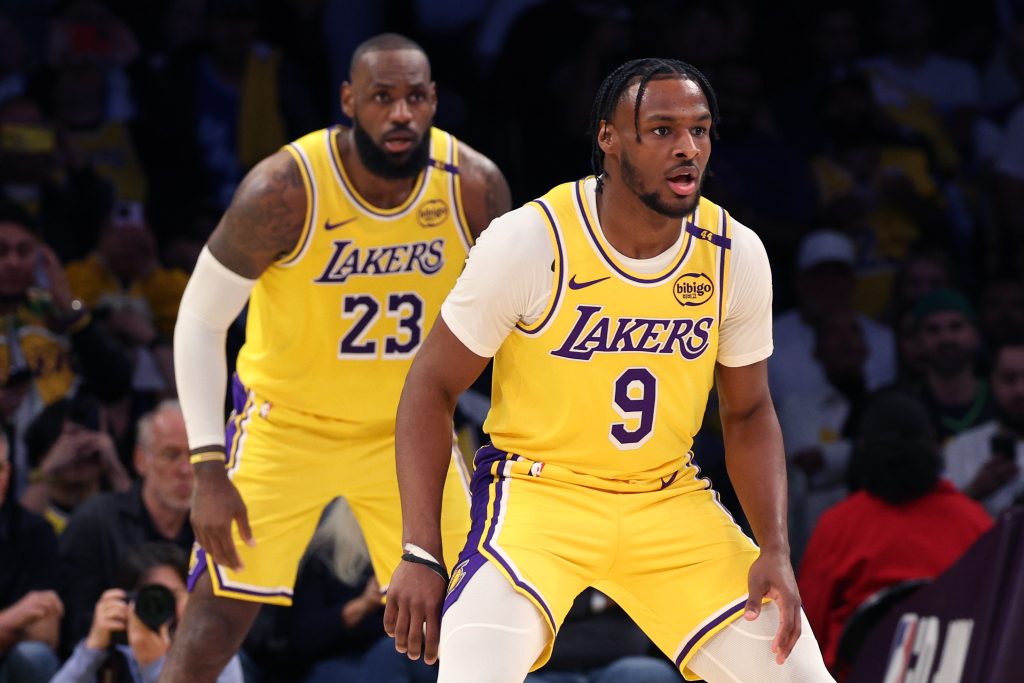 LeBron James #23 and Bronny James #9 of the Los Angeles Lakers on defense during the second quarter against the Minnesota Timberwolves at Crypto.com Arena on October 22, 2024 in Los Angeles, California.