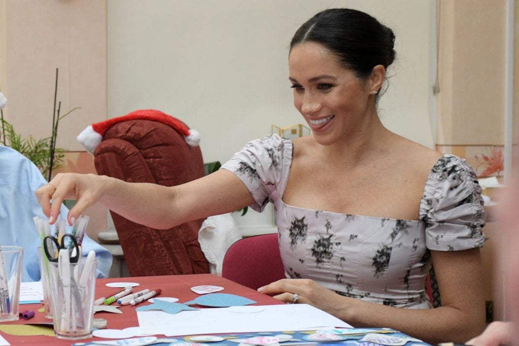 Britain's Meghan, Duchess of Sussex joins in making Christmas decorations during her visit to the Royal Variety Charity's residential nursing and care home, Brinsworth House in Twickenham, south west London on December 18, 2018.