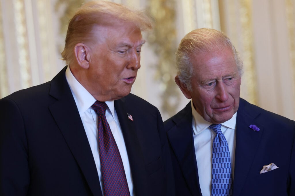 King Charles III (R) and US President Donald Trump view items on display during a visit to the Royal Collection exhibition, in the Green Drawing Room during the State visit by the President of the United States of America at Windsor Castle on September 17, 2025 in Windsor, England. 
