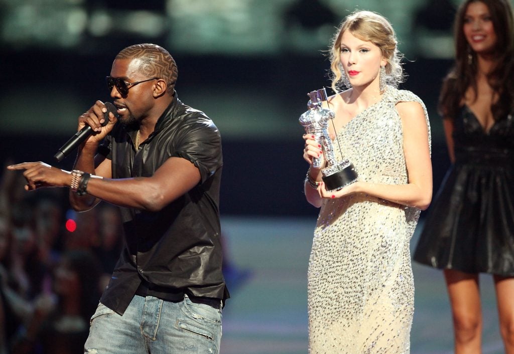 Kanye West umps onstage after Taylor Swift won the Best Female Video award during the 2009 MTV Video Music Awards at Radio City Music Hall on September 13, 2009 in New York City. Kanye West umps onstage after Taylor Swift won the Best Female Video award during the 2009 MTV Video Music Awards at Radio City Music Hall on September 13, 2009 in New York City.