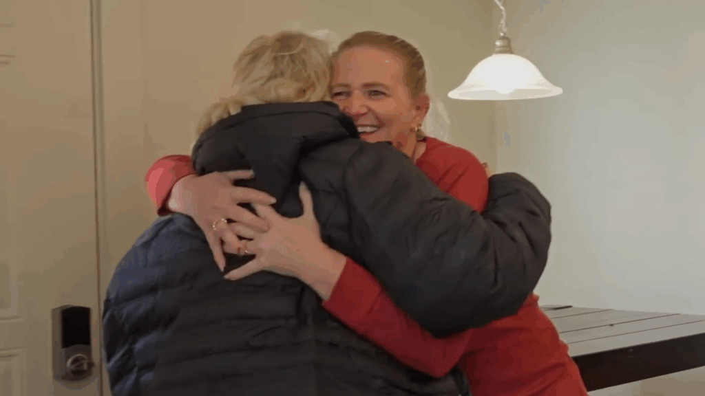 Christine Brown hugs Janelle Brown. Christine Brown hugs Janelle Brown.