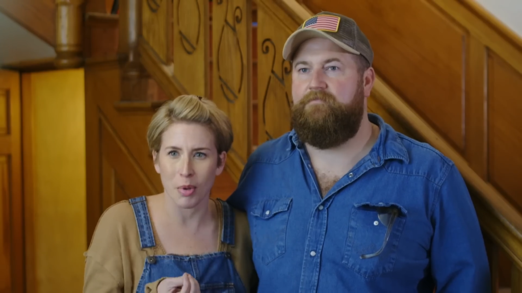 Erin Napier and Ben Napier in front of wood paneling.