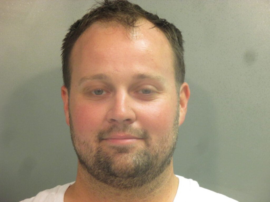 In this handout photo provided by the Washington County Sheriffâs Office, former television personality on 19 Kids And Counting Josh Duggar poses for a booking photo after his arrest April 29, 2021 in Fayetteville, Arkansas. 