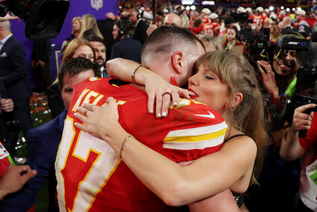 Travis Kelce of the Kansas City Chiefs and Taylor Swift embrace after defeating the San Francisco 49ers 25-22 in overtime during Super Bowl LVIII at Allegiant Stadium on February 11, 2024 in Las Vegas, Nevada. 