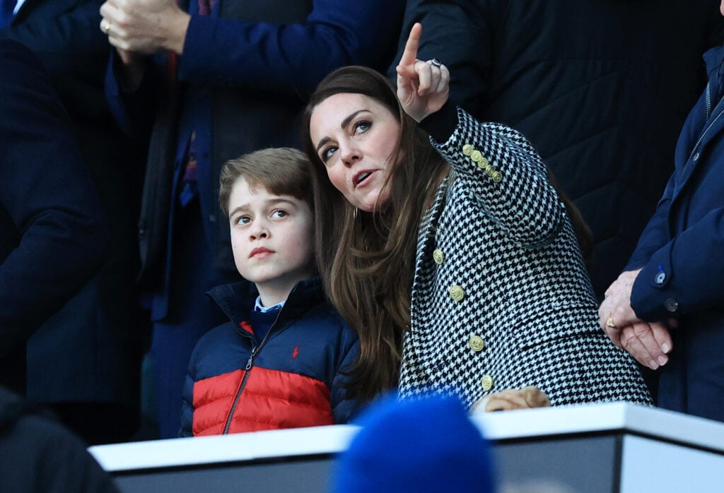 Catherine, Duchess of Cambridge speaks to their son Prince George of Cambridge prior to the Guinness Six Nations Rugby match between England and Wales at Twickenham Stadium on February 26, 2022 in London, England. 