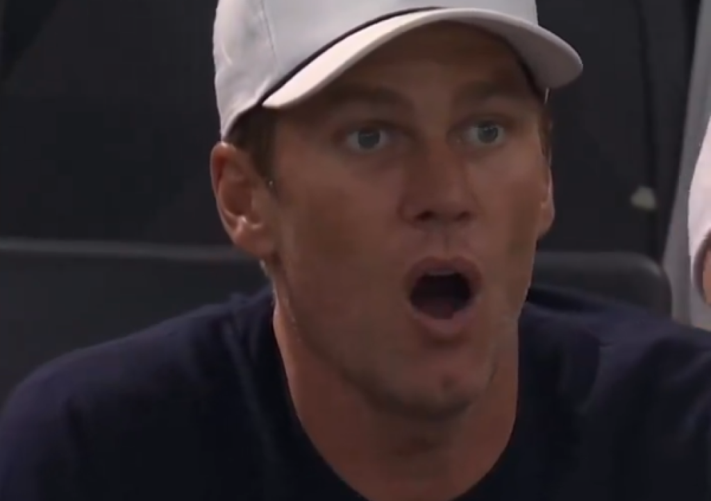 A screenshot of Tom Brady with his mouth open in awe.