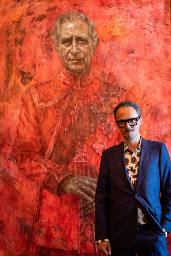 Jonathan Yeo stands in front of the portrait of the King Charles III by artist Jonathan Yeo as it is unveiled in the blue drawing room at Buckingham Palace on May 14, 2024 in London, England.