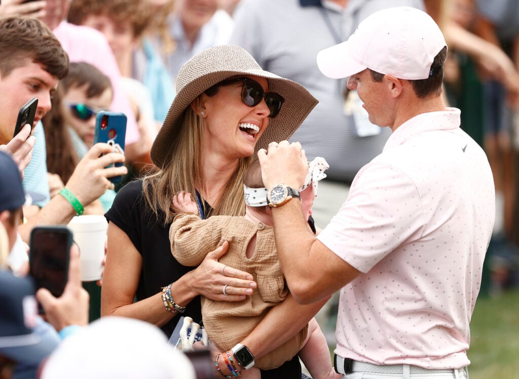 Rory McIlroy of Northern Ireland celebrates with his wife Erica and daughter Poppy after winning during the final round of the 2021 Wells Fargo Championship at Quail Hollow Club on May 09, 2021 in Charlotte, North Carolina.