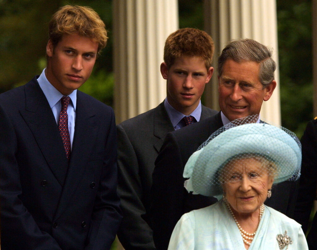 A young Prince William, Prince Harry, a not so young Prince Charles, and the late Queen Mother in 2001.