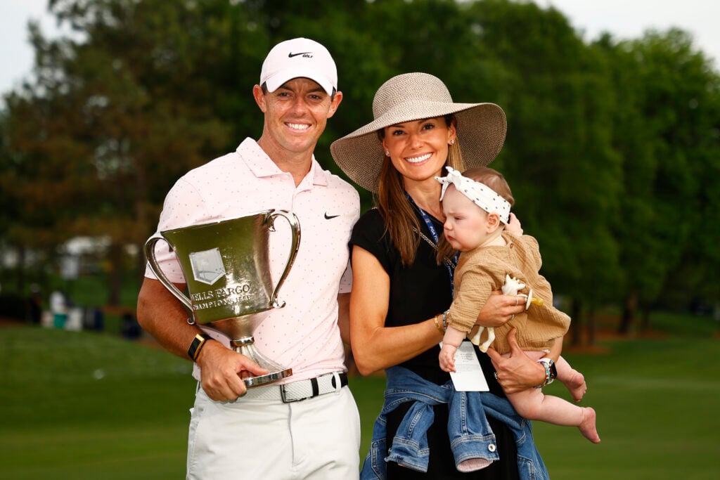 Rory McIlroy of Northern Ireland celebrates with the trophy alongside his wife Erica and daughter Poppy after winning during the final round of the 2021 Wells Fargo Championship at Quail Hollow Club on May 09, 2021 in Charlotte, North Carolina.