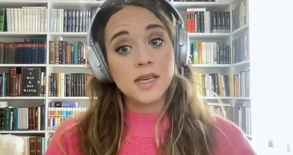 Jinger Duggar in headphones on YouTube.