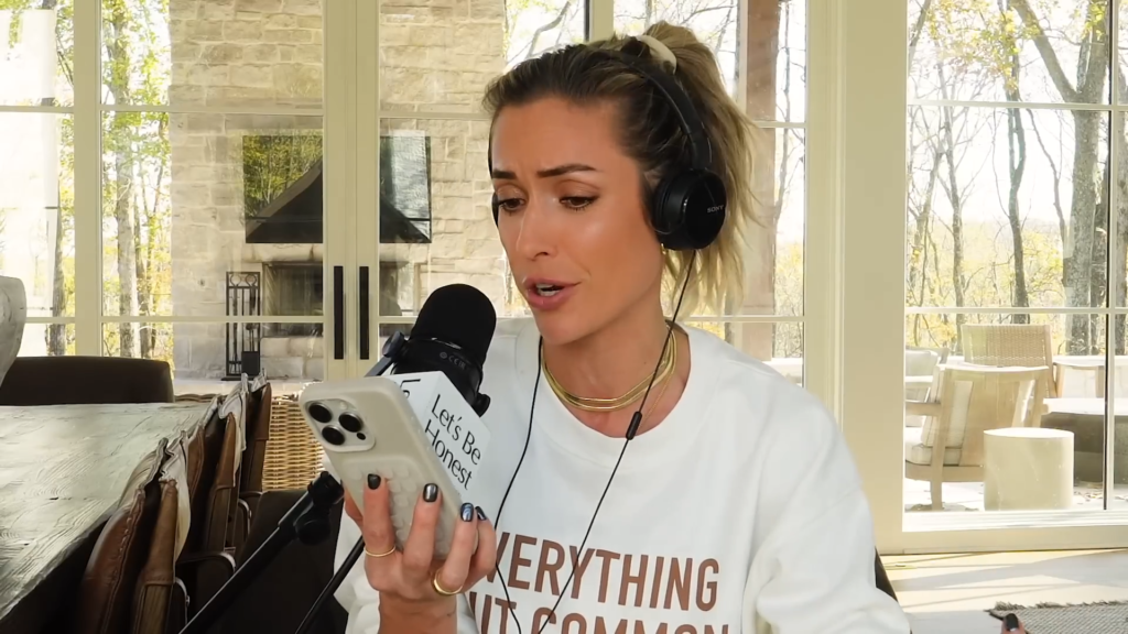 Kristin Cavallari reads from her phone on her podcast, with a disparaging look on her face.