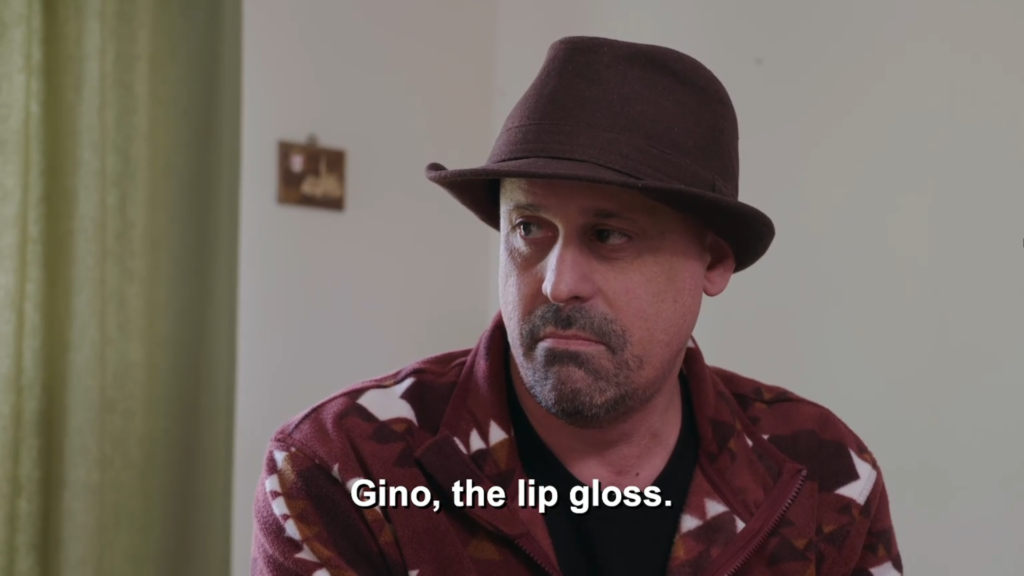 Gino, the lip gloss, the caption reads above Gino Palazzolo.