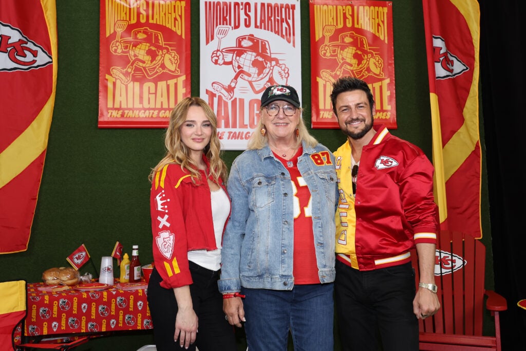 Hunter King, Donna Kelce and Tyler Hynes attend the red carpet at the World's Largest Tailgate ahead of the Baltimore Ravens v Kansas City Chiefs game at GEHA Field at Arrowhead Stadium on September 05, 2024 in Kansas City, Missouri. 